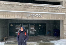 Raisa stood at the front entrance to Cornell University's School of Industrial and Labor Relations.