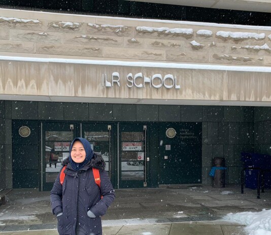 Raisa stood at the front entrance to Cornell University's School of Industrial and Labor Relations.